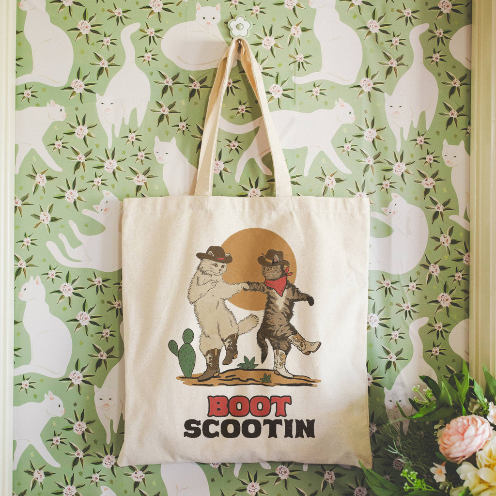 Boot Scootin Kitties tote bag hung on hook wall