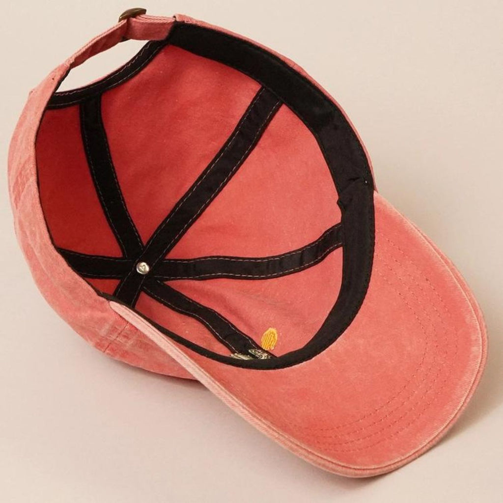 Inside view of a Cactus Embroidered Cotton Baseball Dad Cap in faded red, showing the adjustable strap and black inner lining.