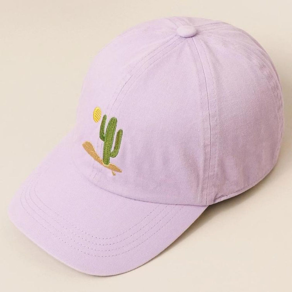 A lavender Cactus Embroidered Cotton Baseball Dad Cap featuring a cactus and sun design on the front with a relaxed fit and pre-curved visor.