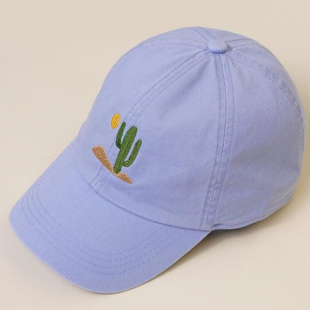 A light blue Cactus Embroidered Cotton Baseball Dad Cap featuring a cactus and sun design on the front with a relaxed fit and pre-curved visor.