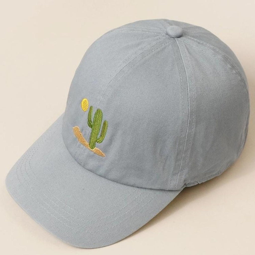 A vintage blue Cactus Embroidered Cotton Baseball Dad Cap featuring a cactus and sun design on the front with a relaxed fit and pre-curved visor.