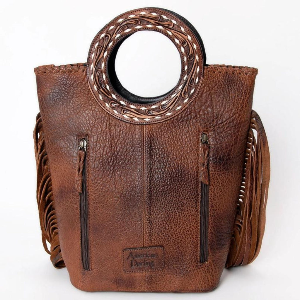 Back view of the Canyon Breeze Leather Tote with vertical zipper pockets and hand-tooled leather details.