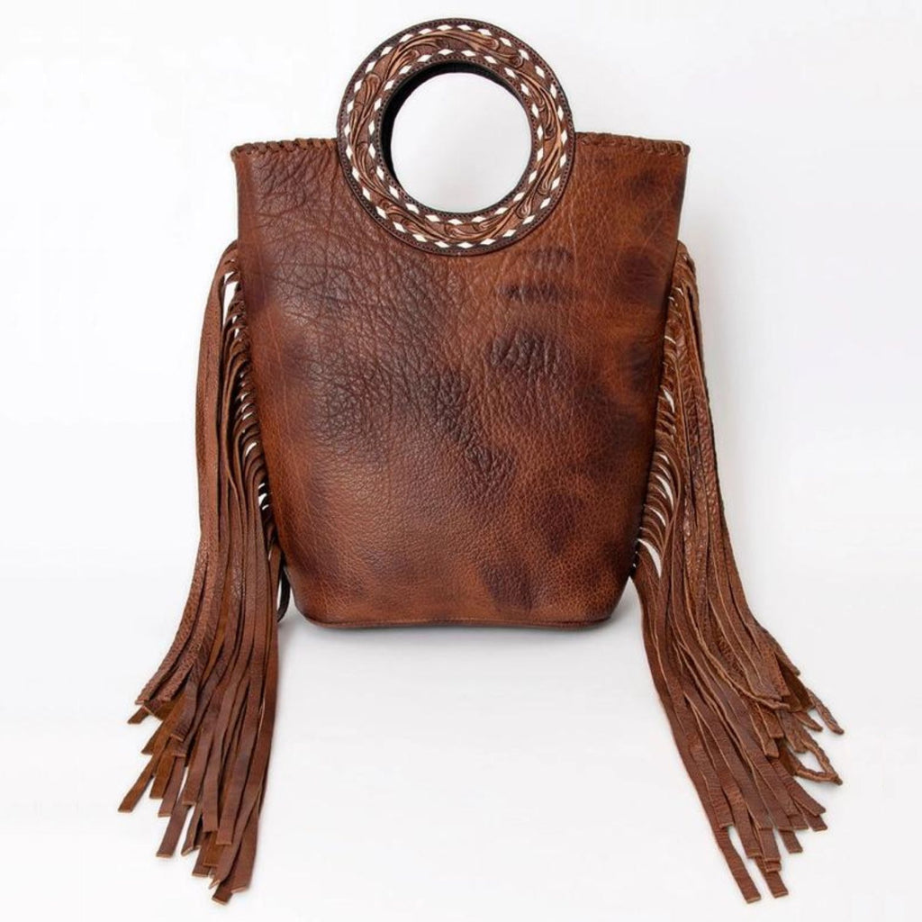 Front view of the Canyon Breeze Leather Tote highlighting its full-grain leather and decorative leather fringe.