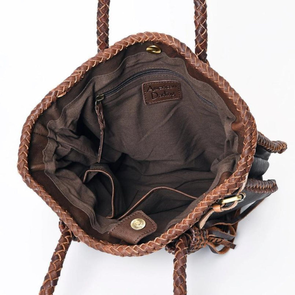 Interior view of the Braided Sage Western Leather Tote in Chestnut Brown, featuring spacious compartments and zipper pocket with American Darling logo.