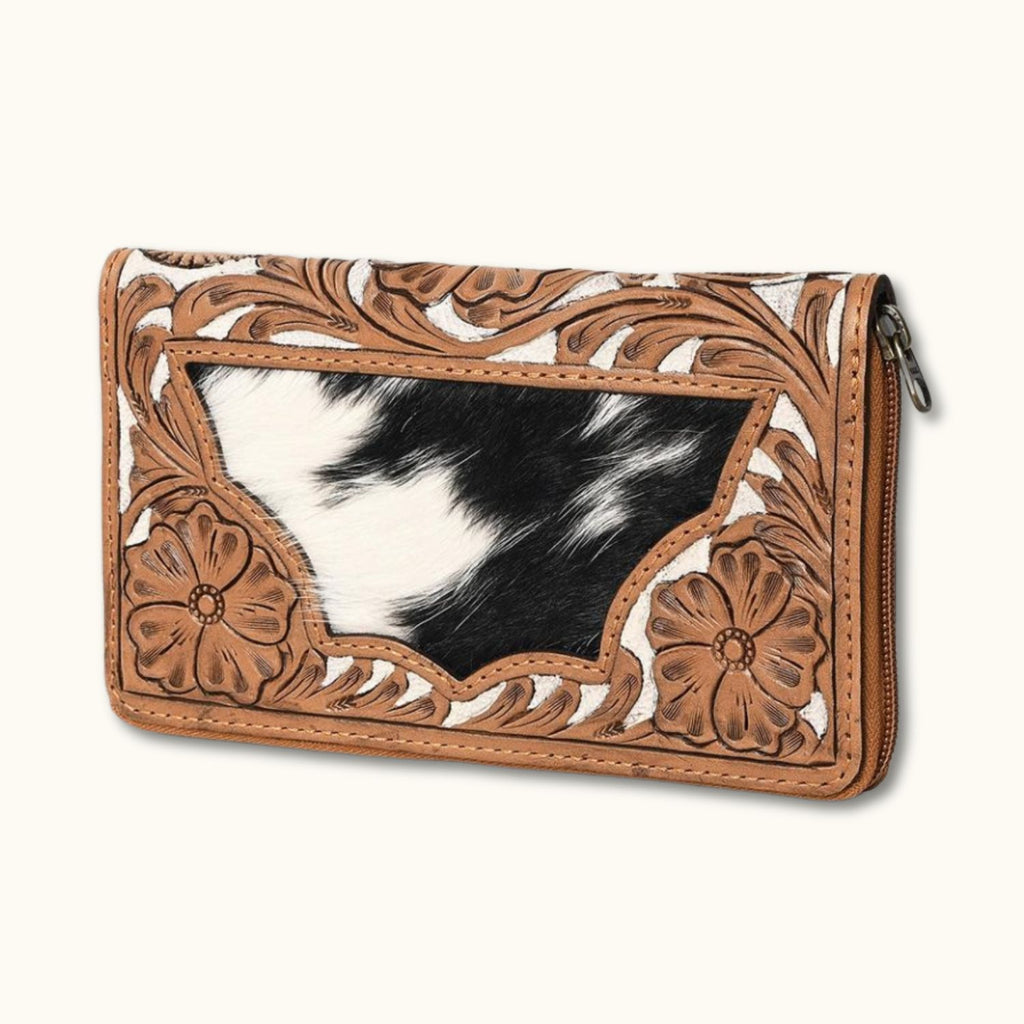 Side view of the cowhide leather wallet with detailed floral tooling.