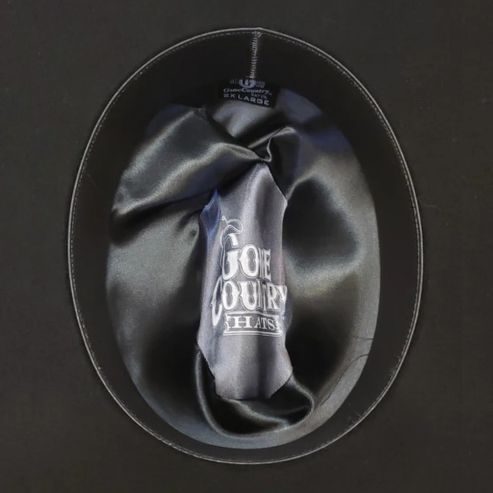 Interior view of the Dakota Range Black Cowboy Hat, lined with black satin and embroidered with the 'Gone Country Hats' logo, made from a premium blend of Bolivian cashmere and wool.