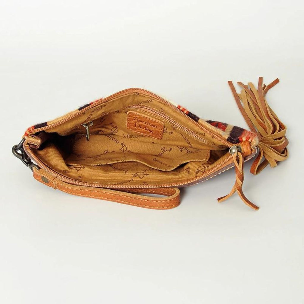 Interior view of the Desert Bloom Handcrafted Wristlet showing fabric lining and zipper closure.