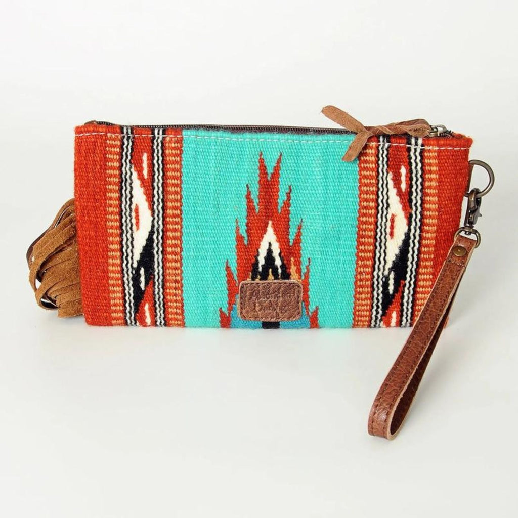 Back view of the Rodeo Spirit Wool & Leather Wristlet showing the vibrant turquoise and red woven pattern with leather wrist strap.