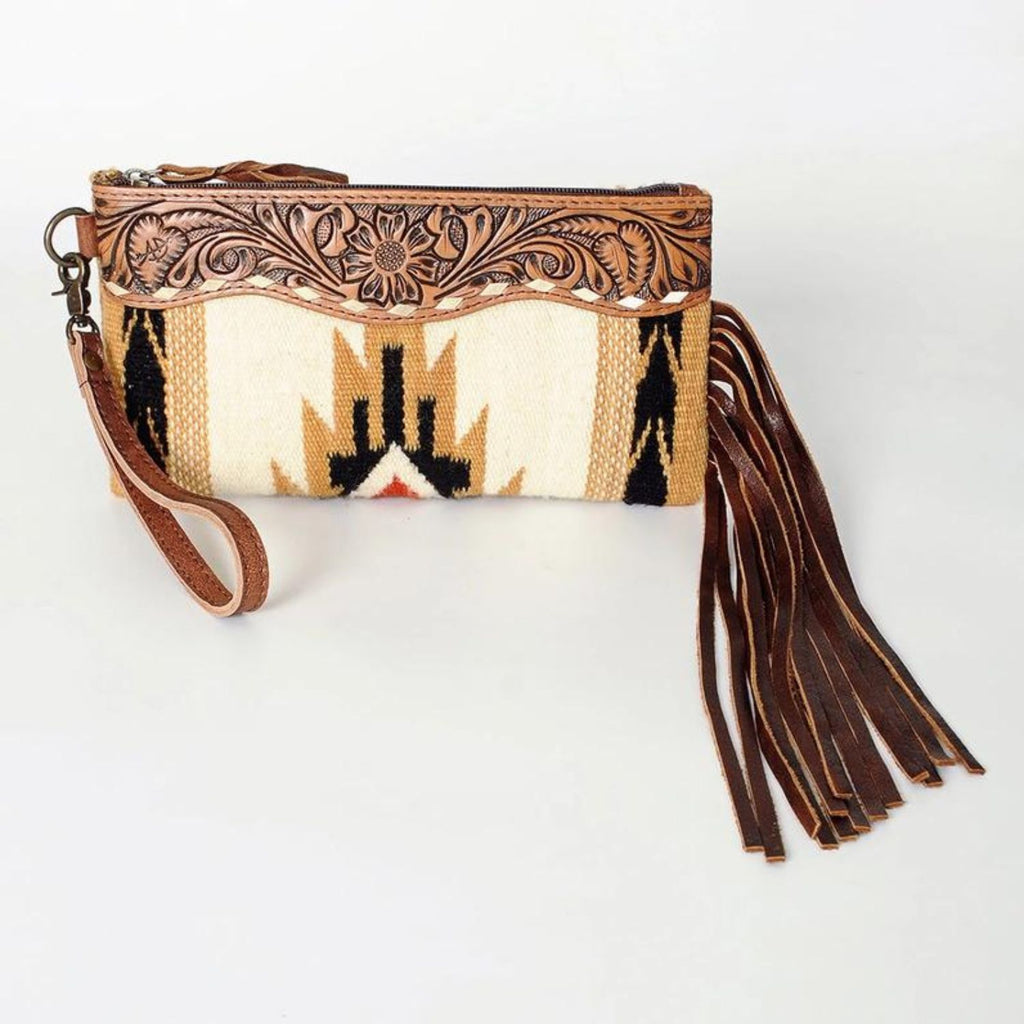 Front view of Saddle Blanket Sunset Leather Wristlet with hand-tooled leather details, western wool pattern, and leather fringes.