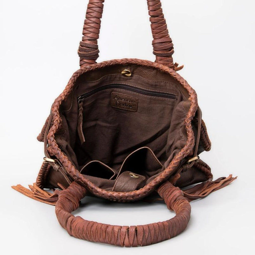 Interior view of the Saddle Brown Western Braided Leather Tote featuring spacious compartments and zipper pocket for organized storage.