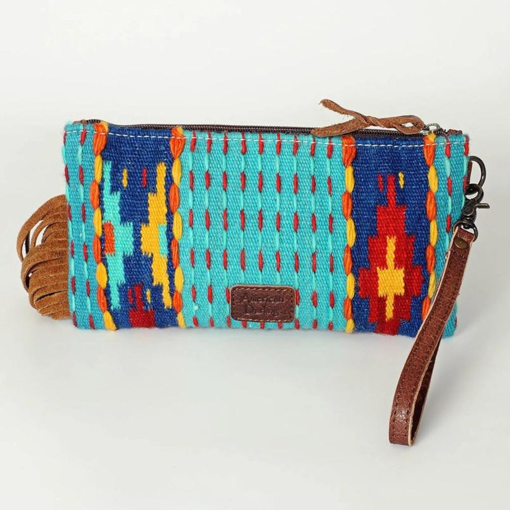 Back view of Sierra Sky Leather Fringe Bag with handwoven turquoise, red, yellow, and blue southwestern design, featuring a simple woven pattern without fringe.