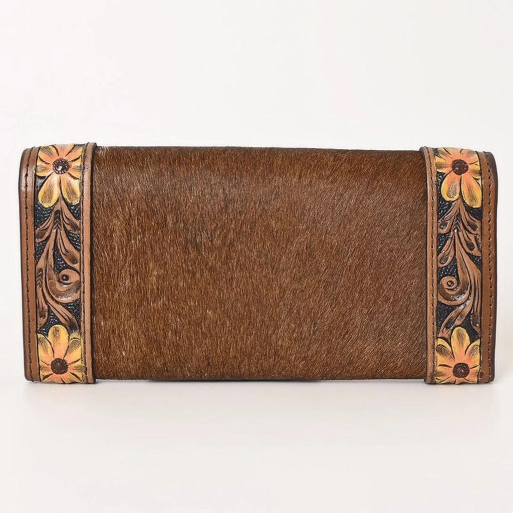 Back view of the Sunflower Trail Leather Wallet featuring smooth cowhide leather and hand-tooled floral accents on both ends.