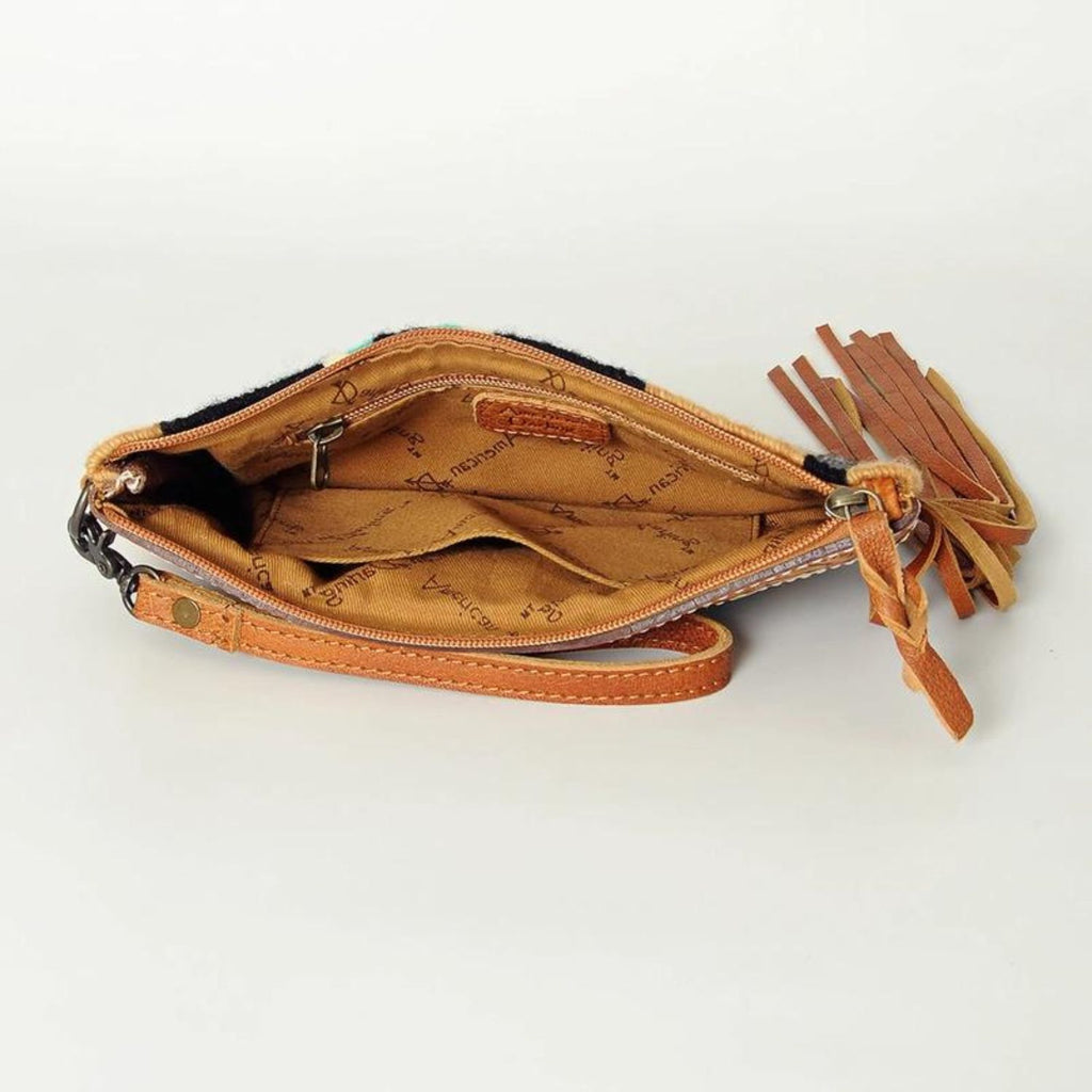 Interior view of the Western Trails Leather Fringe Wristlet showing fabric lining and zipper closure.