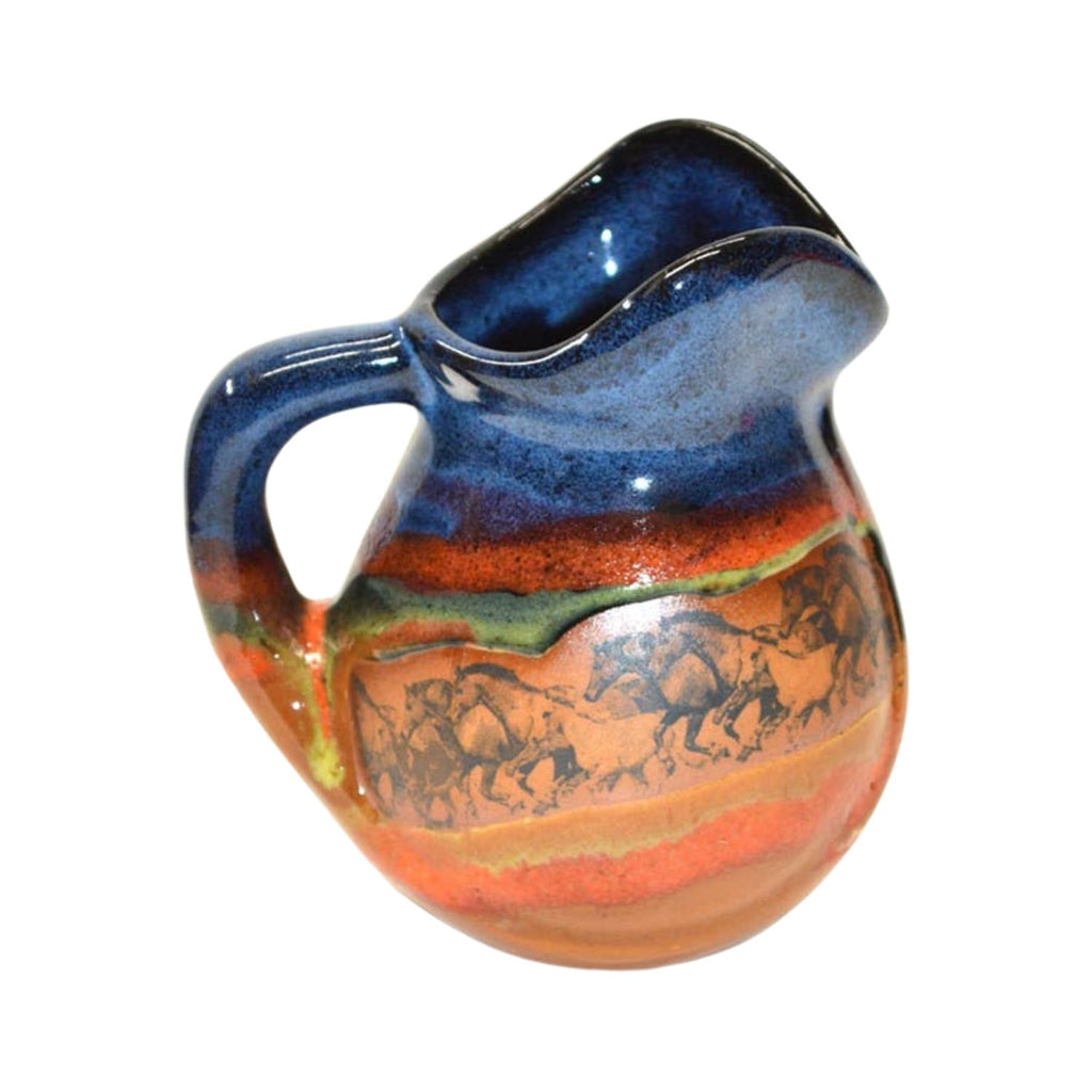 Handcrafted stoneware creamer featuring galloping horses design