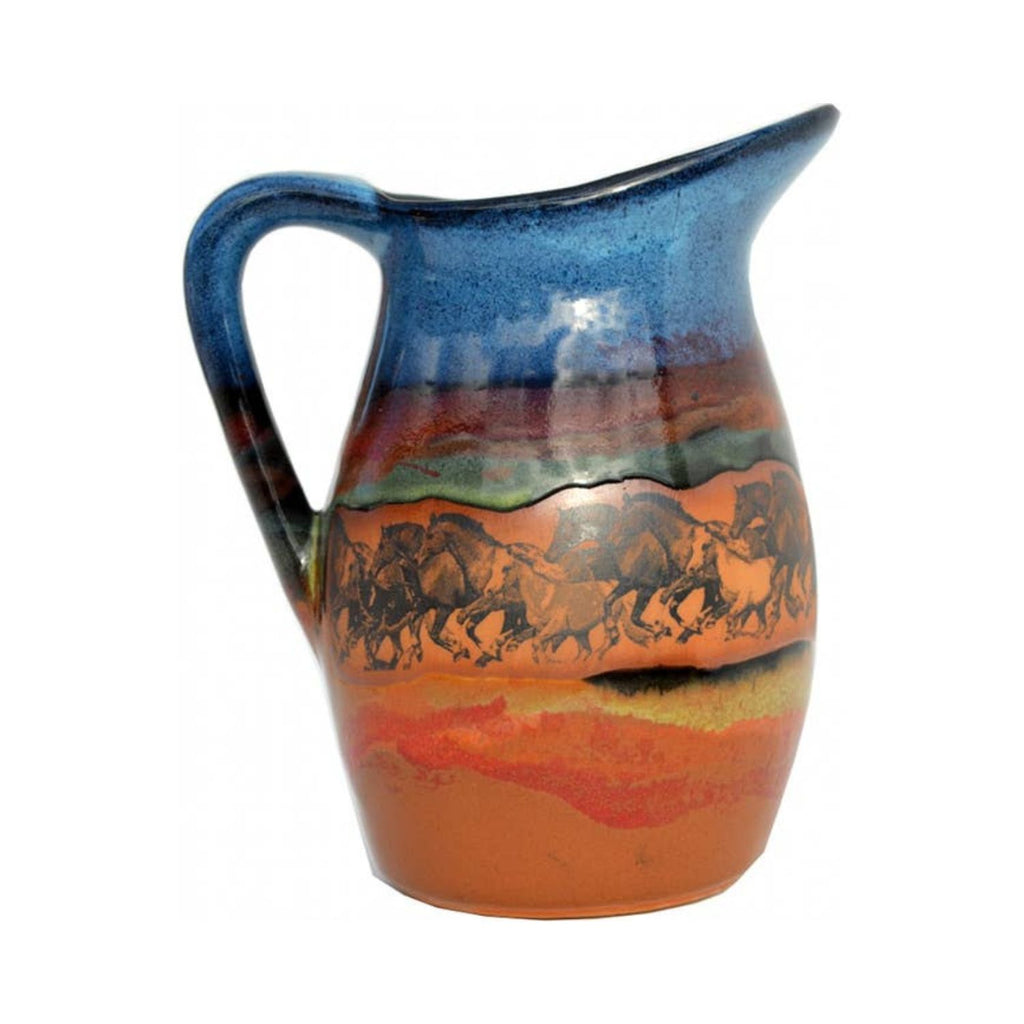 Handmade stoneware milk pitcher featuring galloping horses on a desert landscape